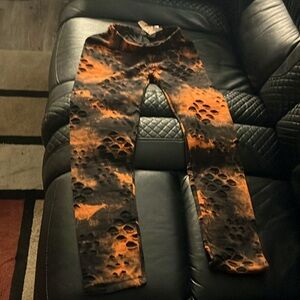 Love the classic Orange and black legging with closed holes junior small